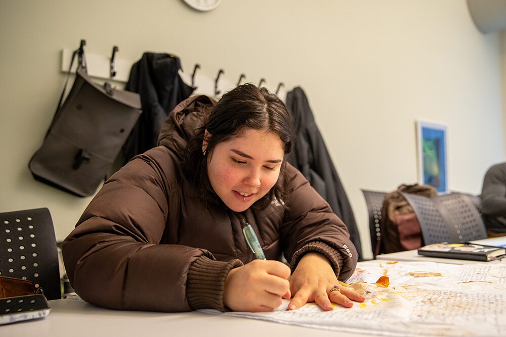 Betsy working on her final personal art project for class.